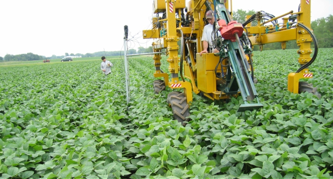 This is a picture of a tractor equipped with sensors with shadowbands for mapping leaf area index.